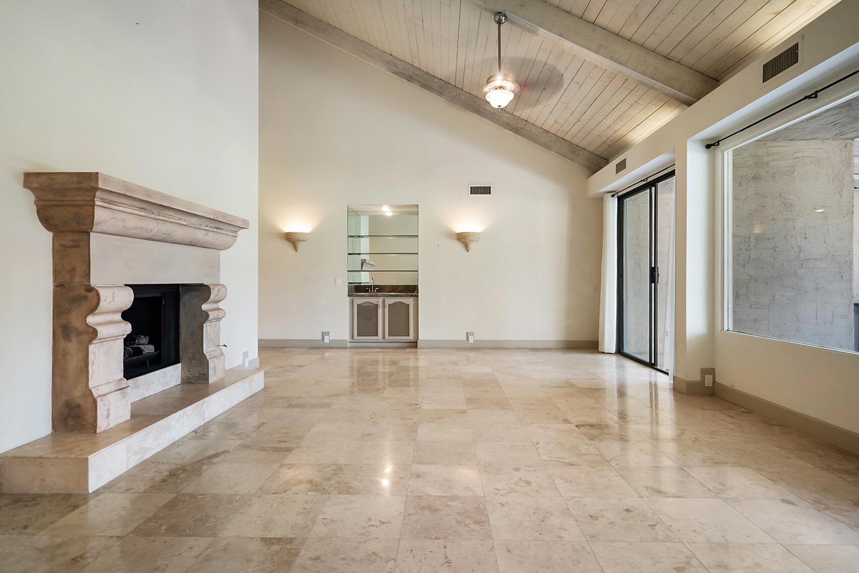 137 Desert W Drive Rancho Mirage, CA 92270 - Photo 8 of 56 a view of an empty room with a fireplace and a window
