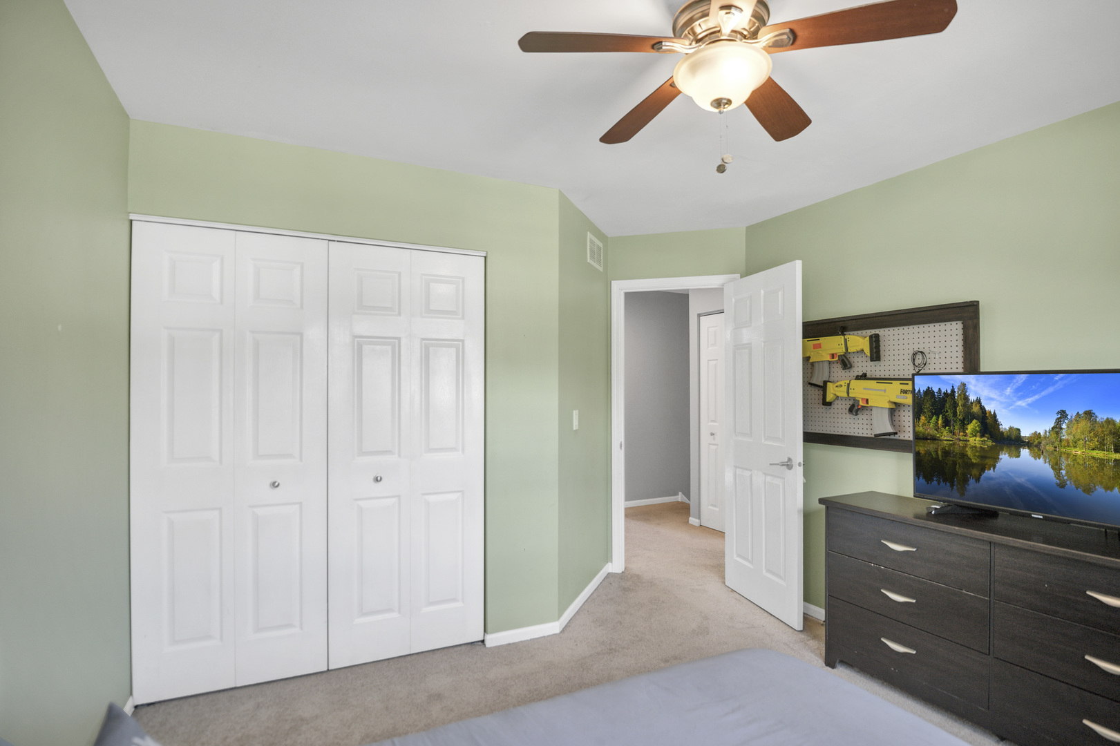 1374 Northgate Drive Bartlett, IL 60103 - Photo 36 of 38 a bedroom with a bed and a chandelier fan