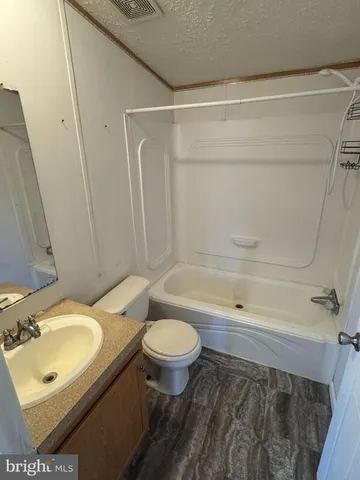 a bathroom with a sink a toilet and a bathtub