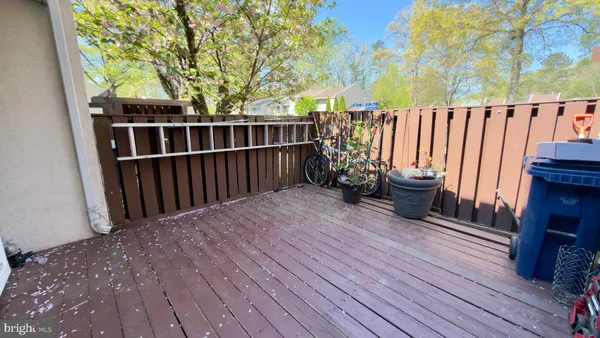 a view of deck with wooden floor and seating space