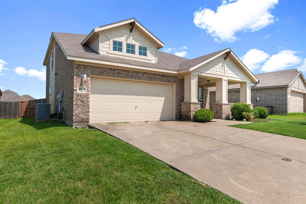 4650 Elderberry Street Forney, TX 75126 - Photo 2 of 31 a front view of a house with a yard and garage