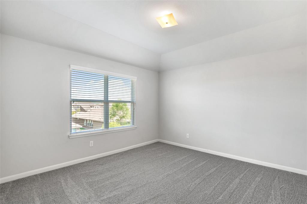 4650 Elderberry Street Forney, TX 75126 - Photo 21 of 31 an empty room with a window