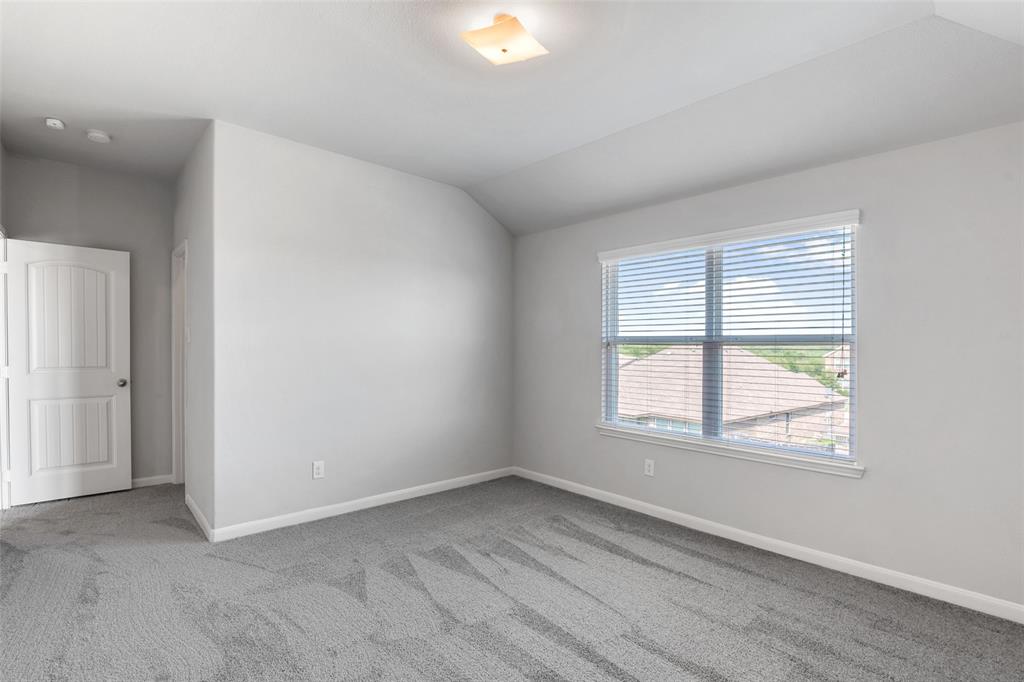 4650 Elderberry Street Forney, TX 75126 - Photo 22 of 31 an empty room with wooden floor and windows