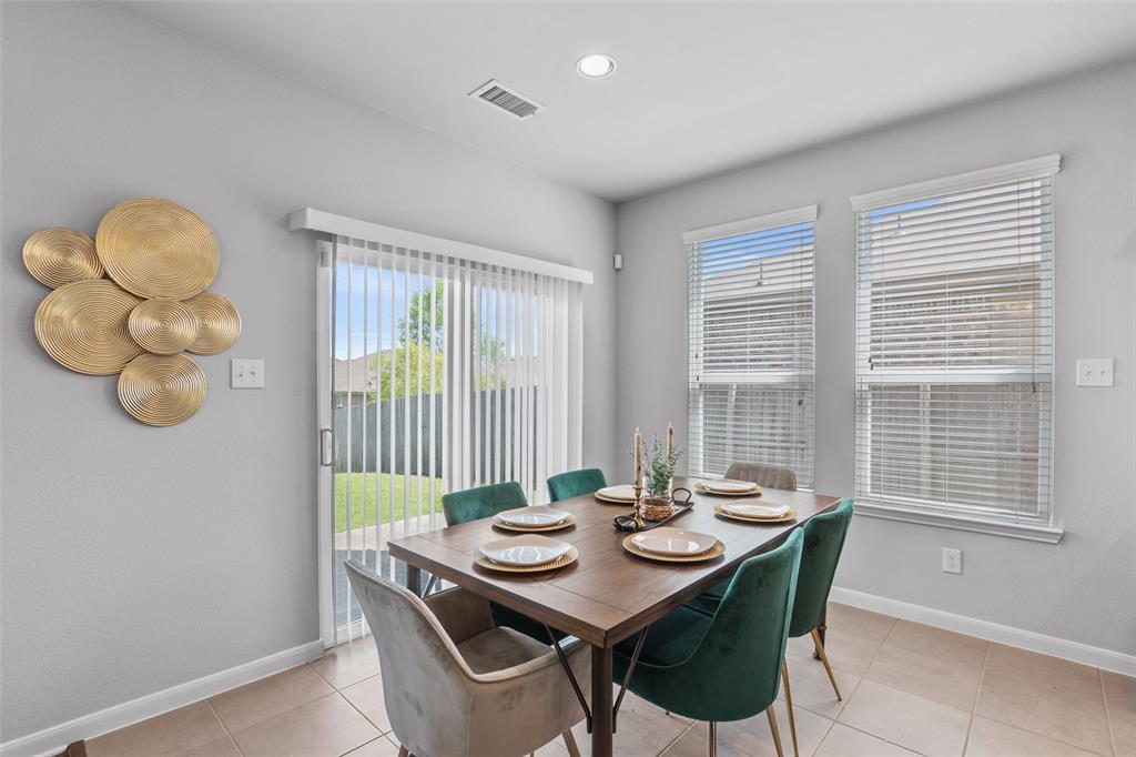 4650 Elderberry Street Forney, TX 75126 - Photo 7 of 31 a view of a dining room with furniture window and outside view