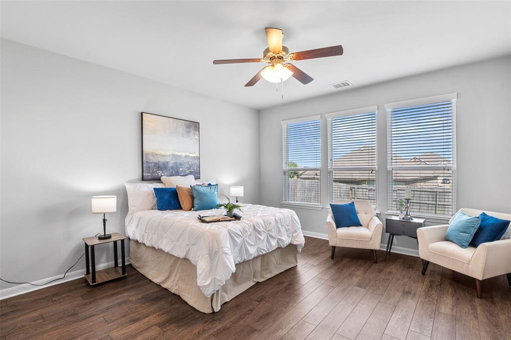 4650 Elderberry Street Forney, TX 75126 - Photo 10 of 31 a bedroom with a bed and a couch