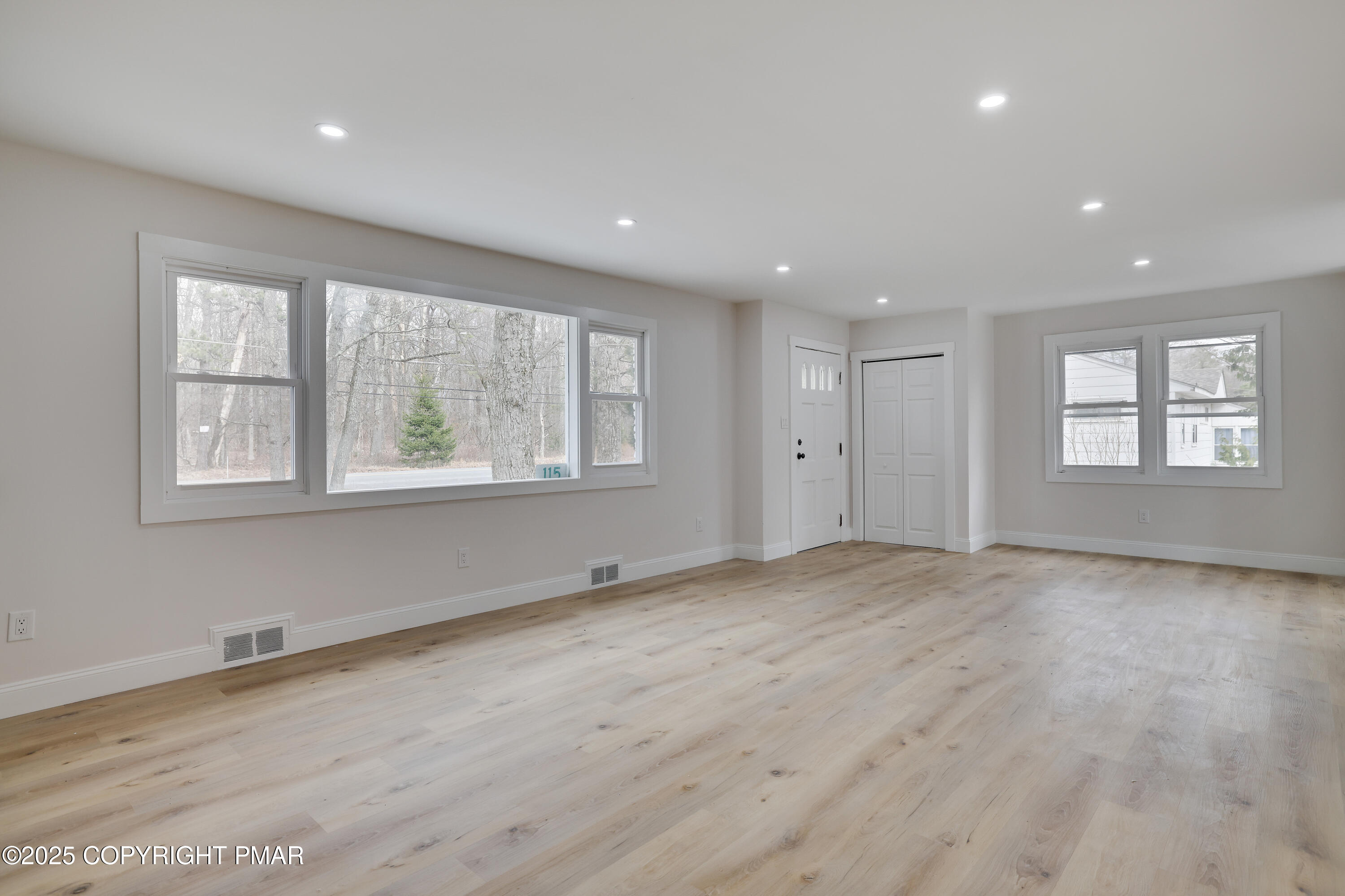 115 Knob Road Mount Pocono, PA 18344 - Photo 3 of 44 a view of an empty room with a window and wooden floor