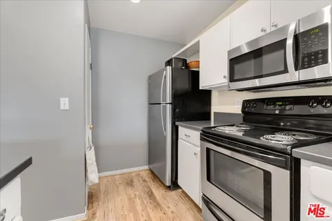a living room with fireplace furniture and a flat screen tv