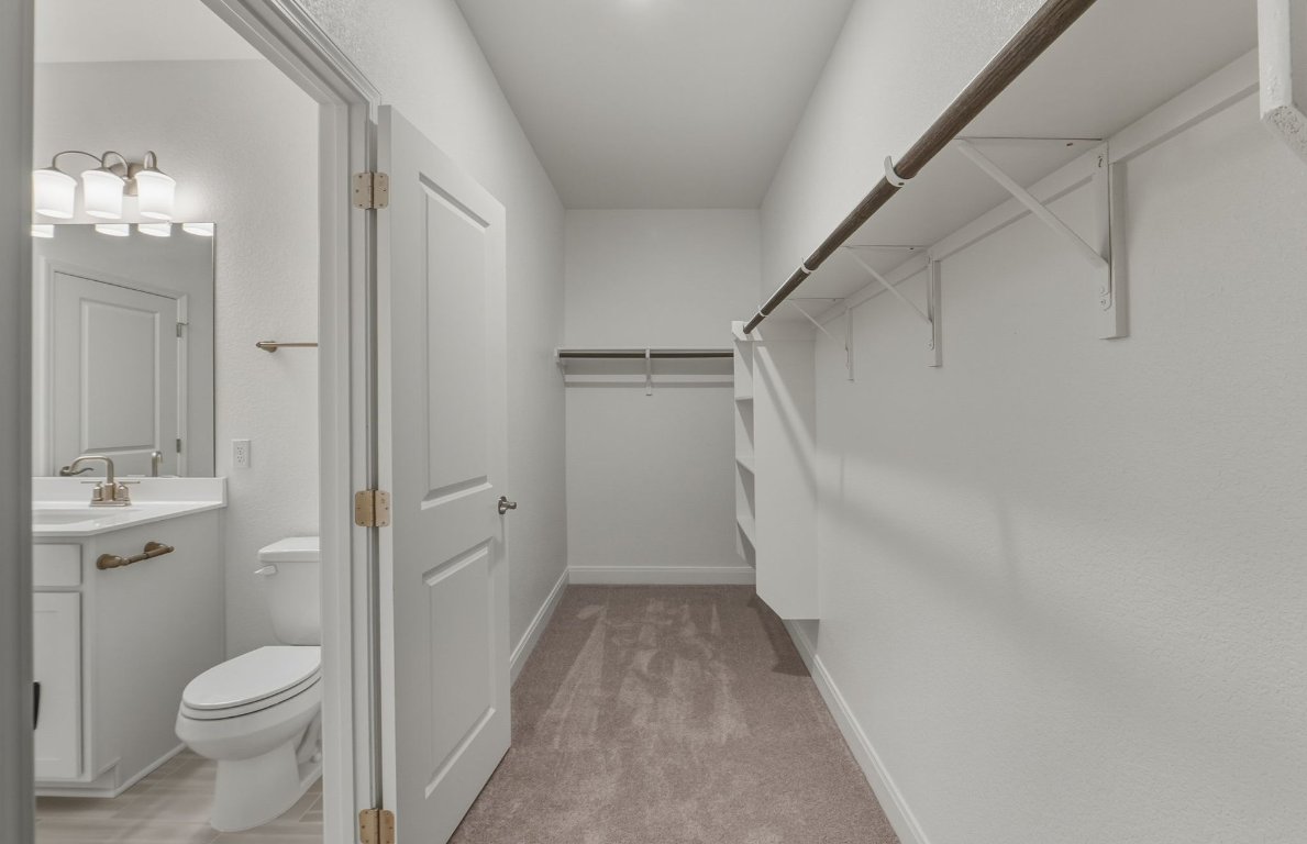 216 Daniels Dusty Trail Georgetown, TX 78626 - Photo 11 of 23 a bathroom with a sink a toilet and shower