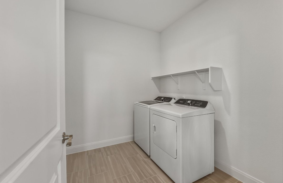 216 Daniels Dusty Trail Georgetown, TX 78626 - Photo 18 of 23 a utility room with dryer and washer