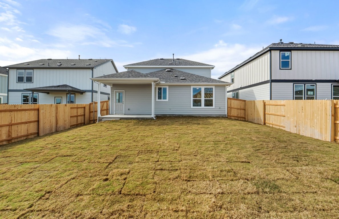 216 Daniels Dusty Trail Georgetown, TX 78626 - Photo 19 of 23 a front view of a house with a yard