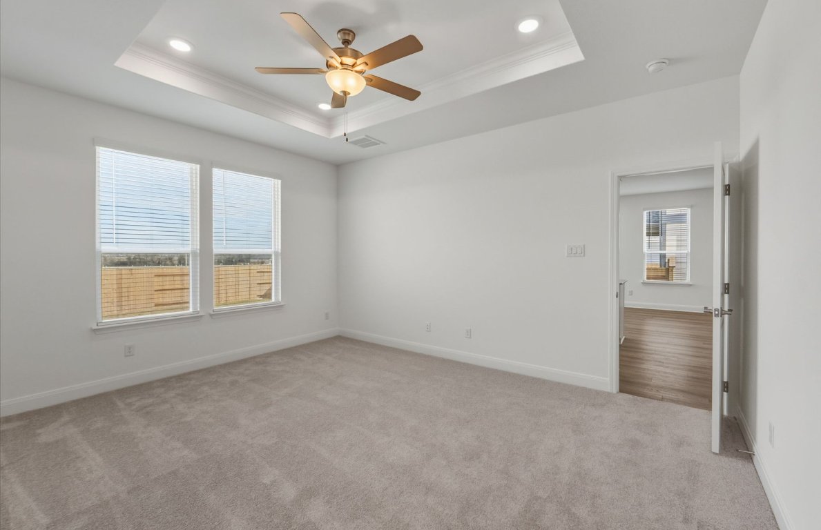 216 Daniels Dusty Trail Georgetown, TX 78626 - Photo 7 of 23 an empty room with a window and a fan