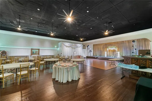 a view of an entryway with furniture and a kitchen view