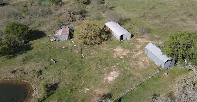 a aerial view of a house with a yard