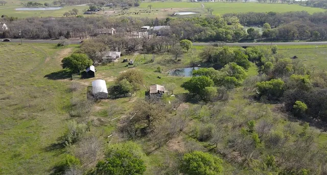 a view of a lake with green space
