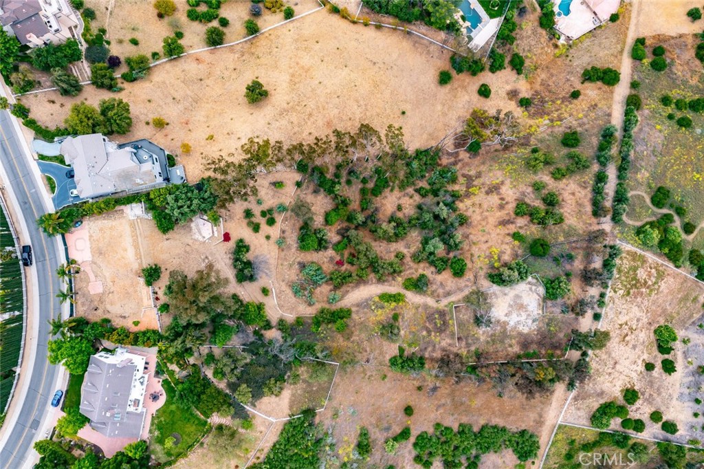73 Dapplegray Road Bell Canyon, CA 91307 - Photo 2 of 8 an aerial view of a house with a yard and garden