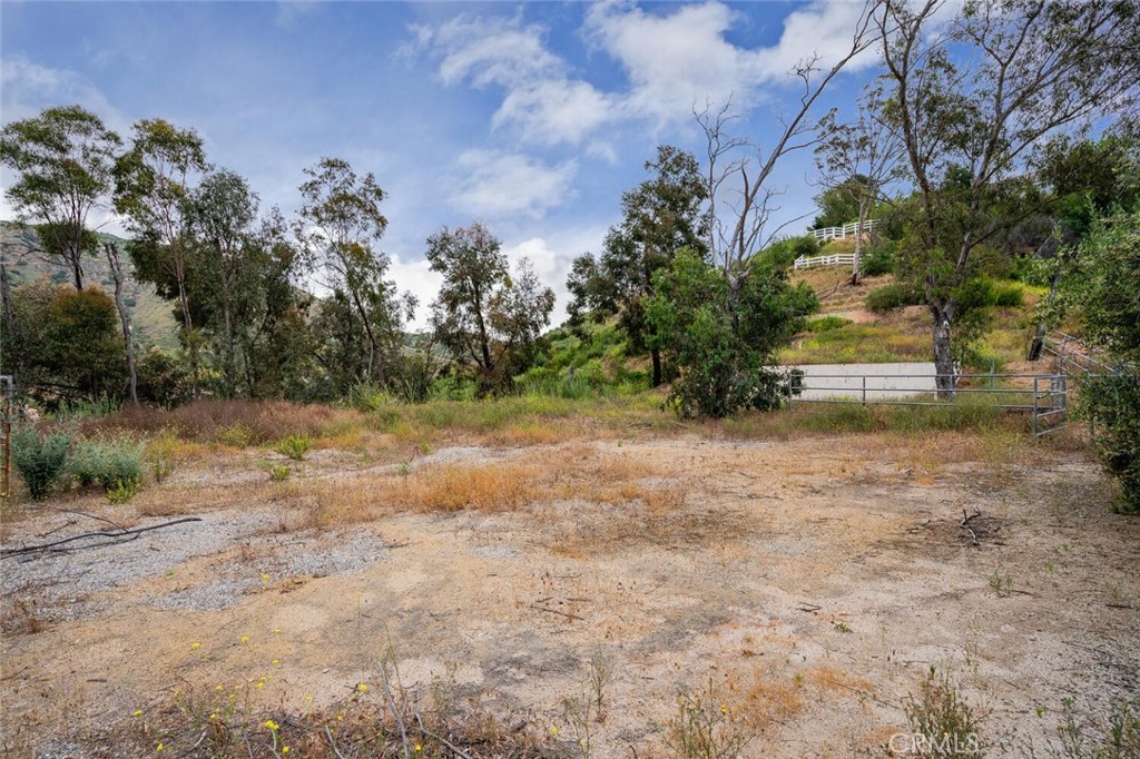 73 Dapplegray Road Bell Canyon, CA 91307 - Photo 4 of 8 a backyard of a house with lots of green space