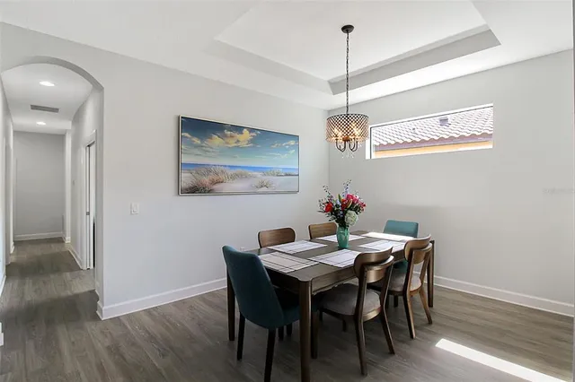 a kitchen with kitchen island granite countertop stainless steel appliances cabinets a sink and a counter top space