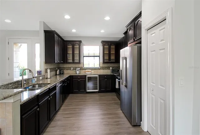 a kitchen with a sink and cabinets