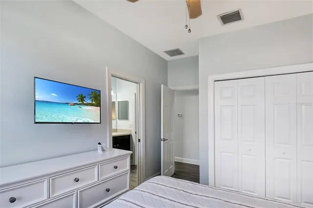a bathroom with a granite countertop sink mirror and a bathtub