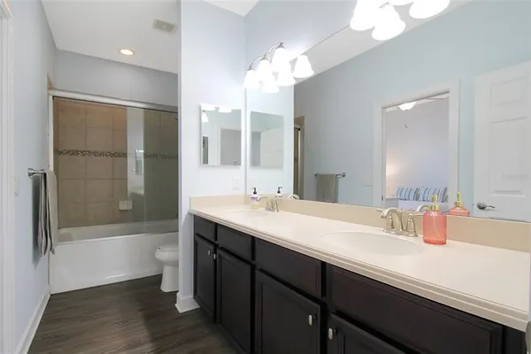 a bathroom with a shower and a toilet
