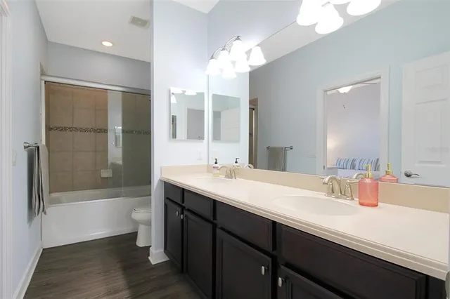 a bathroom with a shower and a toilet