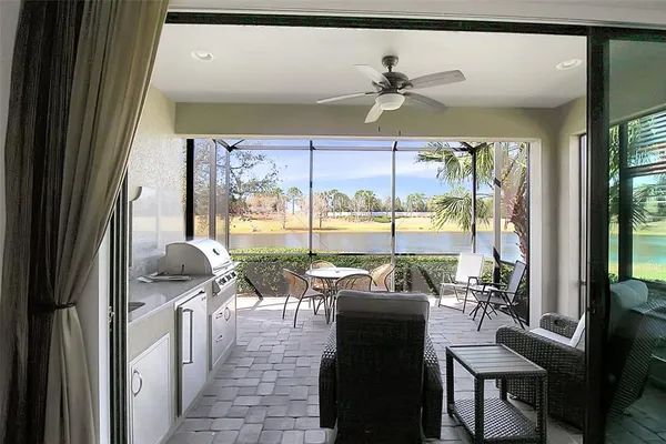 a kitchen with stainless steel appliances granite countertop a stove a refrigerator and a wooden cabinets