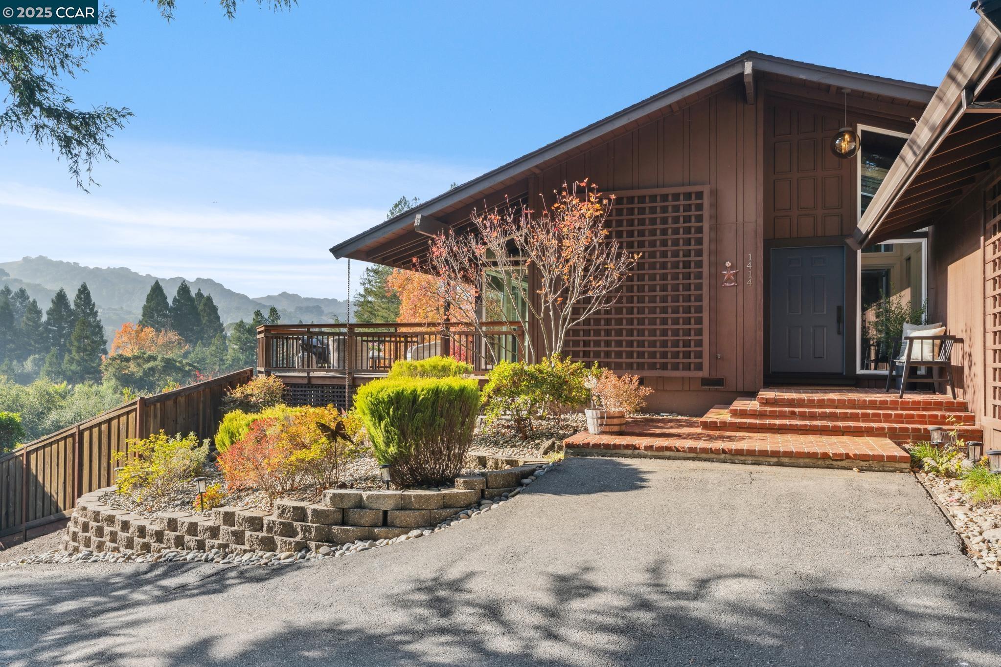 a view of a house with backyard porch and sitting area