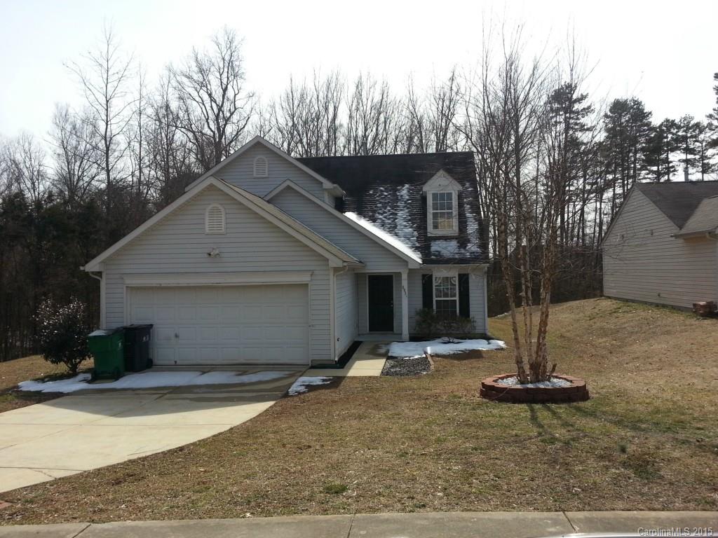 8931 Foggy Meadow Road Charlotte, NC 28269 - Photo 1 of 13 a view of a house with backyard and trees
