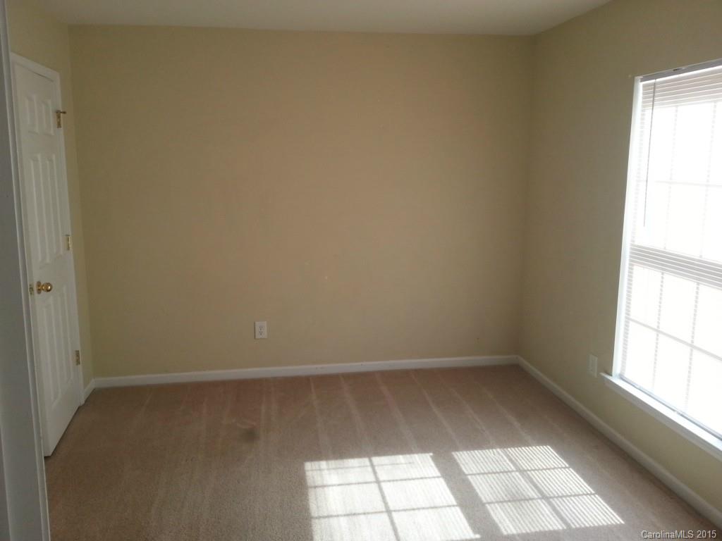 8931 Foggy Meadow Road Charlotte, NC 28269 - Photo 11 of 13 a view of empty room with window