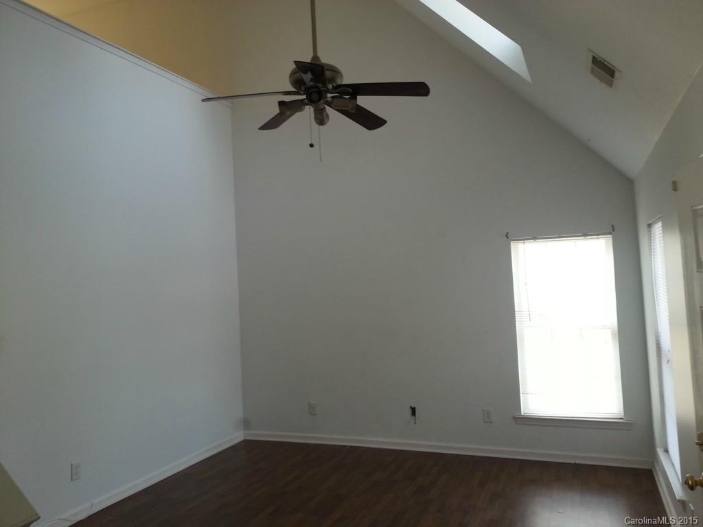 8931 Foggy Meadow Road Charlotte, NC 28269 - Photo 3 of 13 an empty room with a window