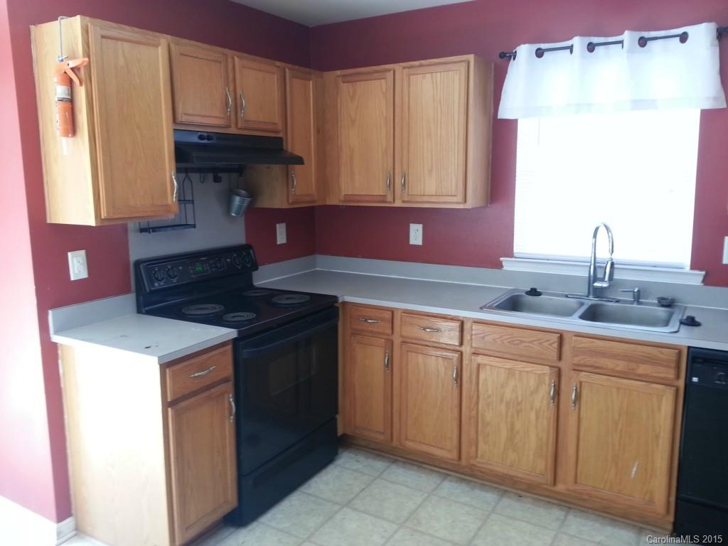 8931 Foggy Meadow Road Charlotte, NC 28269 - Photo 7 of 13 a kitchen with a sink and cabinets