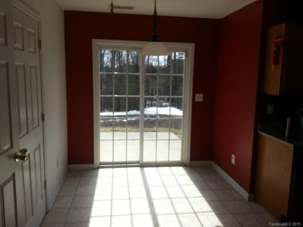 8931 Foggy Meadow Road Charlotte, NC 28269 - Photo 8 of 13 a view of an empty room with a window