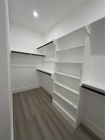 a view of an empty walk in closet