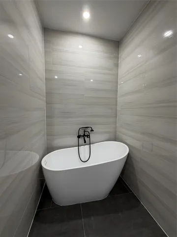 a view of a bathtub in a bathroom