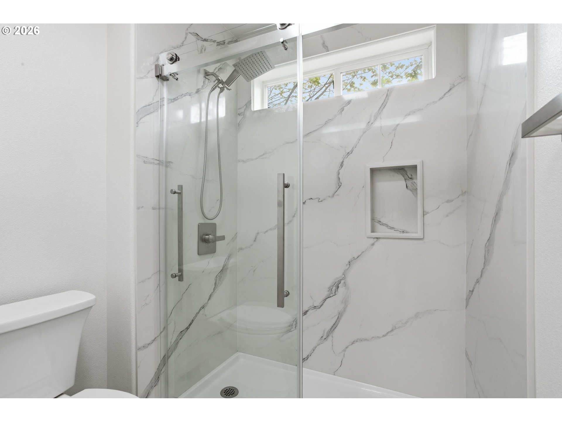 8911 Southwest Gravenstein Lane Tigard, OR 97224 - Photo 27 of 33 a bathroom with a shower and a toilet