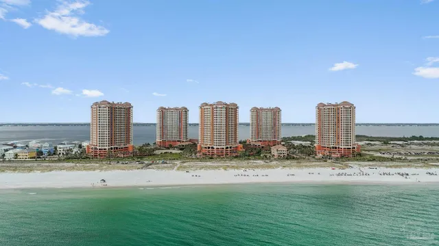 a view of a city with tall buildings and a yard