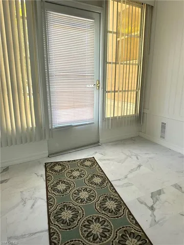 a view of an empty room and window