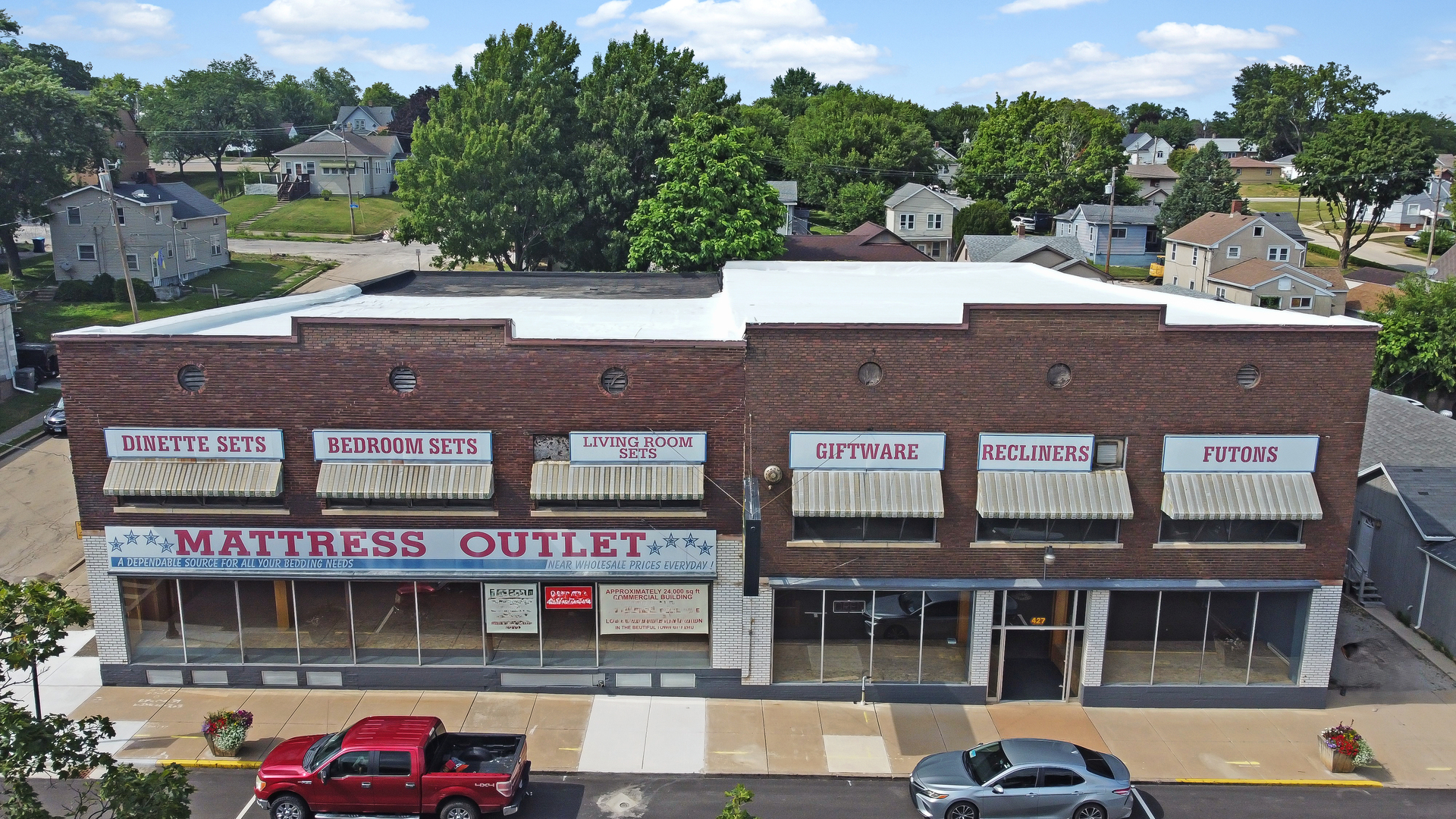 a front view of a building with street view