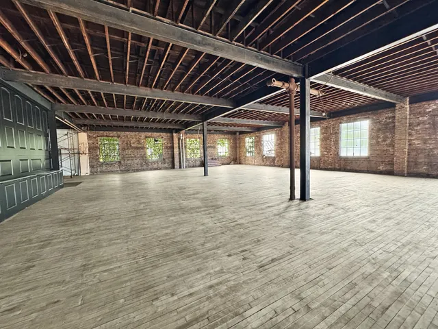 a view of a patio with table and chairs