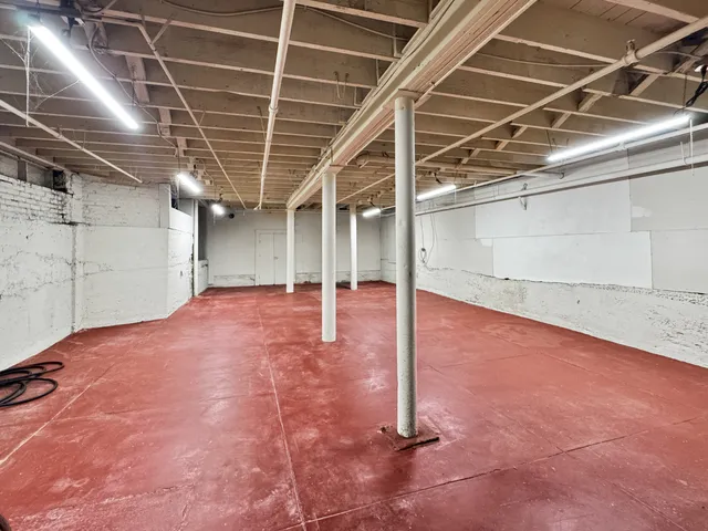 a red brick building with glass windows