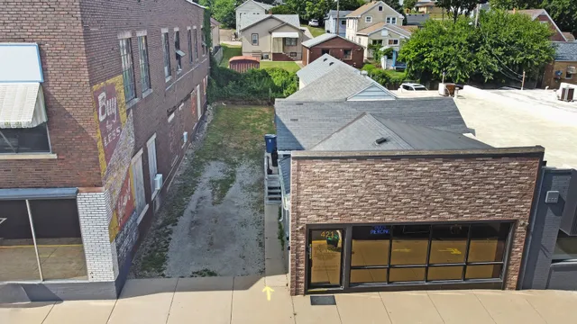 aerial view of a house with a yard
