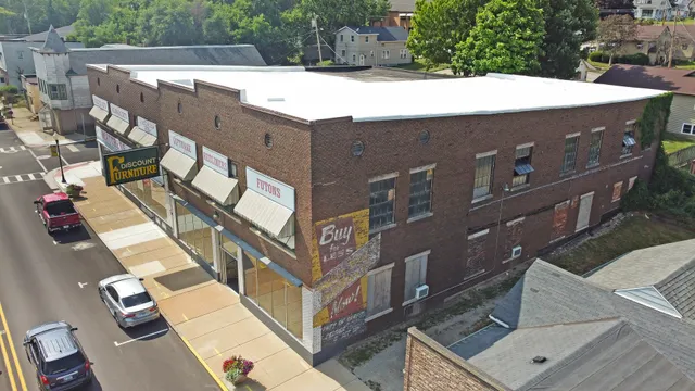 a view of a pathway with a house in the background