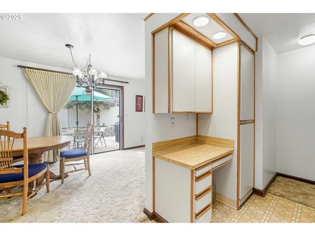 a kitchen with stainless steel appliances granite countertop a stove and a microwave