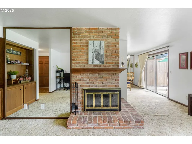 a dining room with furniture and chandelier