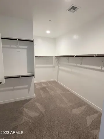 a view of an empty walk in closet