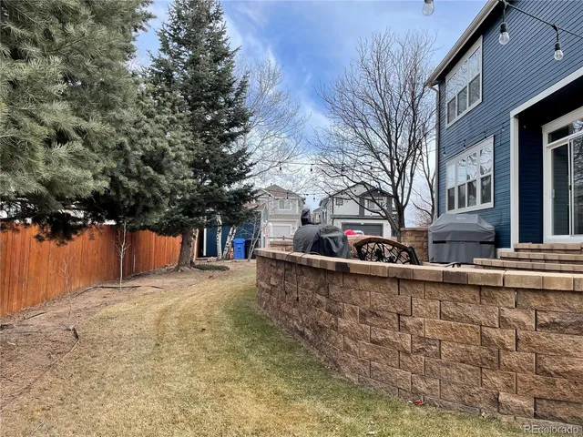 a view of a house with large trees
