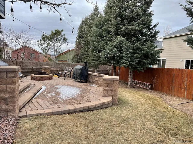 a backyard of a house with portable swimming pool