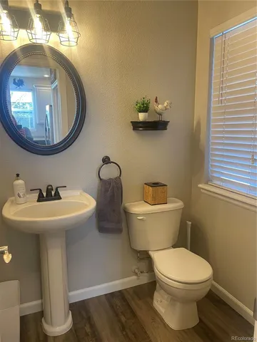 a bathroom with a toilet and a sink