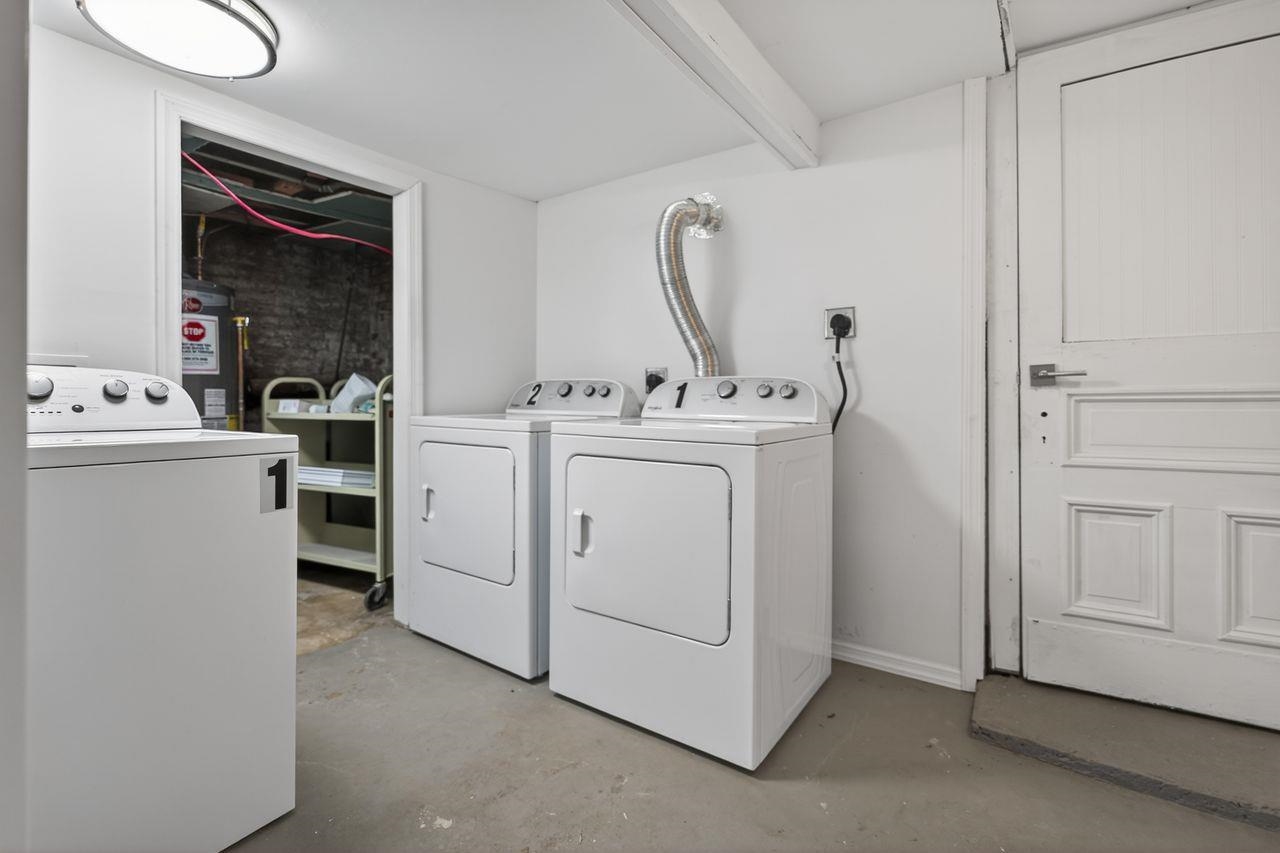 229 Patterson Street Harrison, NJ 07029 - Photo 22 of 26 a view of washer and dryer with bathroom