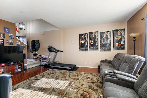 a bedroom with furniture and a flat screen tv